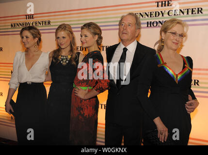 2011 Kennedy Center Honoree Academy Award-winning actress Meryl Streep,62, (R) and her family, husband Don Gummer and daughters Lousia, Mamie and Grace, pose for photographers on the red carpet as they arrive at the Kennedy Center for the Performing Arts for a gala evening, December 4, 2011, in Washington.  The Kennedy Center annually salutes a select group for their contributions to the performance arts in America.    UPI/Mike Theiler Stock Photo