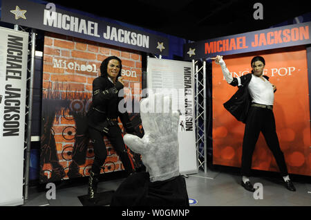 Two Michael Jackson figures from his career are background for Madame Tussaud's unveiling of a two-foot tall wax replica of the singer's iconic silver glove, January 21, 2012, in Washington,D.C. The unveiling marks the 40th anniversary of Jackson's debut as a solo artist on January 24, 1972.   UPI/Mike Theiler Stock Photo