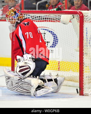 Washington Capitals goalie Braden Holtby is unable to save a shot from Buffalo Sabers' Cody McCormick during the first period at the Verizon Center in Washington, D.C. on March 27, 2012.  UPI/Kevin Dietsch Stock Photo