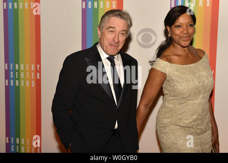 Previous Kennedy Center Honoree Academy Award-winning actor Robert De Niro and his wife Grace Hightower walk past  photographers on the red carpet as they arrive for an evening of gala entertainment at the Kennedy Center, December 1, 2012, in Washington, DC.  The Honors are bestowed annually on five artists for their lifetime achievement in the arts and culture.    UPI/Mike Theiler Stock Photo