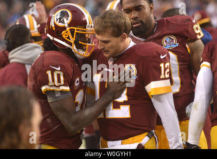https://l450v.alamy.com/450v/w0gyh1/washington-redskins-quarterback-robert-griffin-iii-10-congratulates-back-up-quarterback-kirk-cousins-after-cousins-throw-an-11-yard-touchdown-pass-and-a-two-point-conversion-against-the-baltimore-ravens-at-fedex-landover-maryland-on-december-9-2012-the-redskins-defeated-the-ravens-31-28-upikevin-dietsch-w0gyh1.jpg