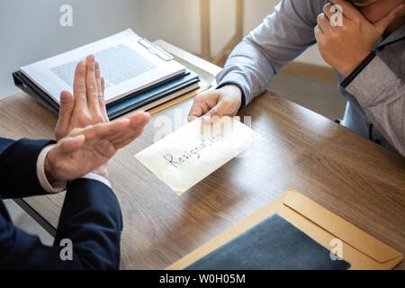 Businessman sending a resignation letter to employer boss in order to dismiss contract, changing and resigning from work concept. Stock Photo