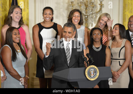 US President Barack Obama makes remarks as he welcomes the UConn 2013 NCAA Women's basketball Champions to the White House, July 31, 2013, in Washington, DC. Obama continued a tradition of welcoming sports champions to the White House and thanking them for their community service.          UPI/Mike Theiler Stock Photo