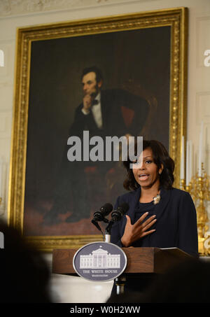 First Lady Michelle Obama welcomes high school and college students from across the country for a workshop with the cast and crew of the film Ò42,Ó in the State Dinning Room at the White House on April 2, 2013 in Washington, D.C. Members of the cast of '42'participated in a discussion about the film, Jackie Robinson and the inspirational themes from his life that students can apply to their own. UPI/Kevin Dietsch Stock Photo