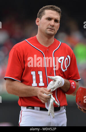 Washington Nationals Ryan Zimmerman takes off batting gloves in between innings against the Minnesota Twins at Nationals Park in Washington, D.C. on June 9, 2013. The Nationals defeated the Twin 7-0.  UPI/Kevin Dietsch Stock Photo