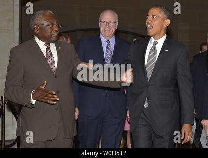 US President Barack Obama (R) is escorted by Assistant Democratic Party Leader Rep. James Clyburn (D-SC), (L), as Vice Chairman of the Democratic Caucus Rep. Joseph Crowley (D-NY) walks with them at the US Capitol after concluding talks with House Democrats, July 31, 2013, in Washington, DC.   The meetings were expected to center on economic issues dividing Democrats and Republicans heading into the fall when Congress returns from summer recess, including a possible government shutdown.       UPI/Mike Theiler Stock Photo