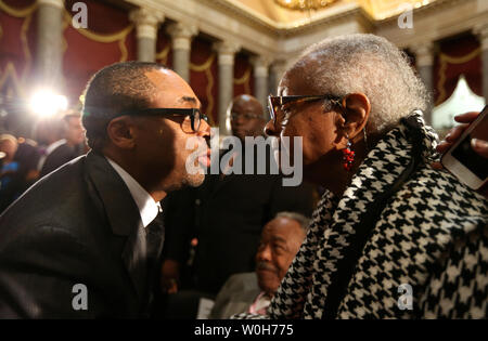 Film maker Spike Lee talks with Maxine McNair, mother of Denise McNair, victim of the 1963 Birmingham bombing, during a Congressional Gold Medal ceremony which was posthumously presented to victims of the bombing at the U.S. Capitol, in Washington on September 10, 2013.  The medal is awarded in recognition of victims Addie Mae Collins, Denise McNair, Carole Robertson and Cynthia Wesley, and how their sacrifice served as a catalyst for the Civil Rights Movement.   UPI/Molly Riley Stock Photo