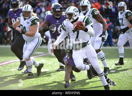 New York Jets quarterback Geno Smith scrambles against the Baltimore Ravens at M&T Bank Stadium in Baltimore, Maryland on November 24, 2013. UPI/Kevin Dietsch Stock Photo