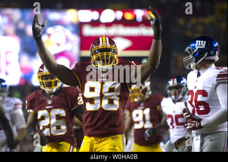 Dec. 24, 2011 - Landover, Maryland, U.S - Minnesota Vikings running back  Adrian Peterson (28) fights to break a tackle by Washington Redskins  outside linebacker Brian Orakpo (98) during Saturday afternoon's game