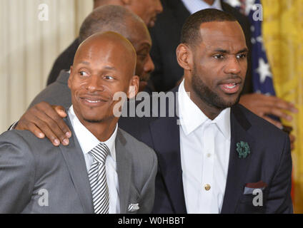 Miami Heat guard Ray Allen (L) and forward LeBron James embrace during an event where President Barack Obama welcomed the 2013 NBA Champions Miami Heat to the White House, in Washington, D.C. on January 14, 2014. The Heat defeated  the San Antonio Spurs in the 2013 playoffs.  UPI/Kevin Dietsch Stock Photo