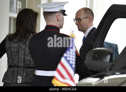 Ukraine's Prime Minister Arseniy Yatsenyuk is greeted at the enytrance to the West Wing as he arrives for a bilateral meeting with President Barack Obama, in the Oval Office, in Washington, DC, March 12, 2014. The leaders are expected to discuss the crisis in Ukraine and Crimea, in the aftermath of the removal of former PM Viktor Yanukovych from power and Russia's move into Crimea.    UPI/Mike Theiler Stock Photo