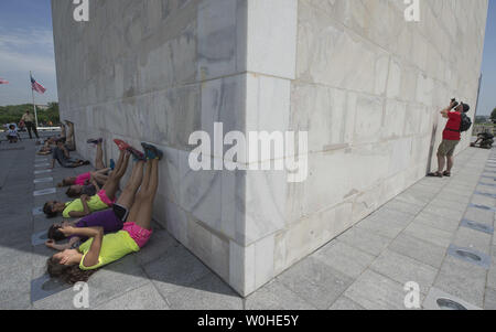 Tourist visit the Washington Monument as it is reopened after nearly three years of repairs and renovations following the 2011 earthquake, in Washington, D.C, May 12, 2014.  The Monument was closed following damages from the unusual 5.8 magnitude earthquake that hit the D.C. region. Cost to repair the monument were apoximatly $15 million, half of which was donated by philanthropist David Rubenstein. UPI/Kevin Dietsch Stock Photo