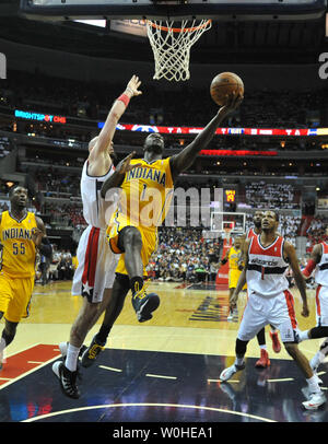 Indiana Pacers guard Lance Stephenson (1) drivers to the basket against Washington Wizards center Marcin Gortat (4) during game six of the Eastern Conference Semifinals at the Verizon Center in Washington, D.C. on May 15, 2014. The Pacers defeated the Wizards 93-80 and advance to the Eastern Conference finals. UPI/Kevin Dietsch Stock Photo