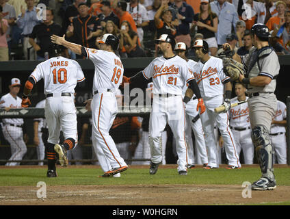 Baltimore Orioles Adam Jones (10), forced at second base, yells to Nelson  Cruz, who scored an RBI on the fielder's choice in the fifth inning against  the Kansas City Royals in game