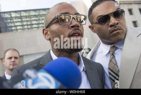 Entertainer Chris Brown leaves the H. Carl Moultrie Courthouse in Washington, D.C. after pleading guilty to assault, September 2, 2014. Brown pleaded guilty to assaulting a man outside a Washington hotel last October and was sentenced to time served. Brown served two days in jail when originally arrested on the charges. UPI/Kevin Dietsch Stock Photo