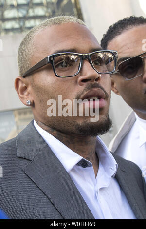 Entertainer Chris Brown leaves the H. Carl Moultrie Courthouse in Washington, D.C. after pleading guilty to assault, September 2, 2014. Brown pleaded guilty to assaulting a man outside a Washington hotel last October and was sentenced to time served. Brown served two days in jail when originally arrested on the charges. UPI/Kevin Dietsch Stock Photo