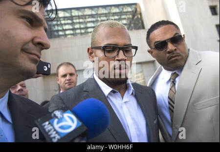 Entertainer Chris Brown leaves the H. Carl Moultrie Courthouse in Washington, D.C. after pleading guilty to assault, September 2, 2014. Brown pleaded guilty to assaulting a man outside a Washington hotel last October and was sentenced to time served. Brown served two days in jail when originally arrested on the charges. UPI/Kevin Dietsch Stock Photo