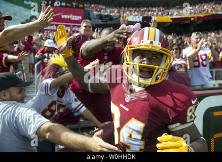 Washington Redskins' Niles Paul celebrates a Tennesee Titans' Dexter  McCluster muffed catch of a punt during the third quarter at FedEx Field in  Landover, Maryland on October 19, 2014. Washington won the