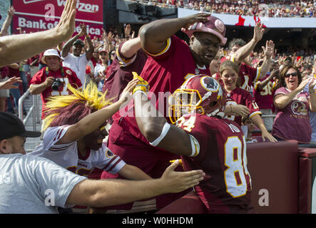 Washington Redskins' Niles Paul celebrates a Tennesee Titans' Dexter  McCluster muffed catch of a punt during the third quarter at FedEx Field in  Landover, Maryland on October 19, 2014. Washington won the