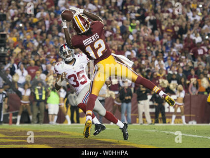 Washington Redskins wide receiver Andre Roberts brings in a touchdown against New York Giants free safety Quintin Demps in the second quarter at FedEx Field in Washington, D.C. on September 25, 2014. UPI/Kevin Dietsch Stock Photo