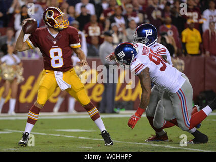 Chicago Bears cornerback Zack Bowman (L) brings down Minnesota