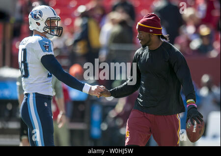 Tennessee Titans long snapper Beau Brinkley warms up before a