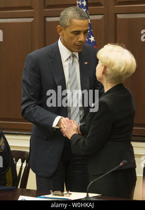 President Barack Obama talks with co producer Michele Tasoff