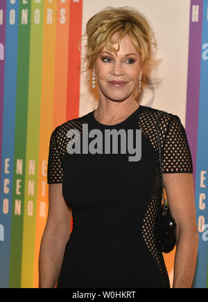 Actress Melanie Griffith poses for photographers on the red carpet as she arrives for an evening of gala entertainment at the Kennedy Center, December 7, 2014, in Washington, DC.  The Kennedy Center Honors are bestowed annually on five artists for their lifetime achievement in the arts and culture.    UPI/Mike Theiler Stock Photo