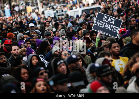 Protestors crowd at the end of the march to listen to speakers during the 'Justice For All' march on December 13, 2014 in Washington, D.C. Activist gathered in the Nations Capitol to bring attention to the recent incidents of police brutality against African Americans and to protest the recent Mike Brown and Eric Garner grand jury decisions. UPI/Gabriella Demczuk Stock Photo