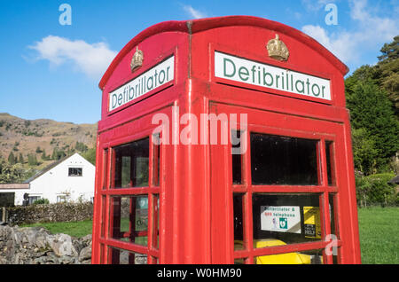 Defibrillator,inside,iconic,red,telephone,box,in,Grasmere,The Lake District National Park,The Lakes,Lake District,,Cumbria,north,England,GB,UK,reuse, Stock Photo