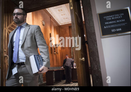 https://l450v.alamy.com/450v/w0hnb9/a-legislative-assistant-for-a-member-of-the-senate-budget-committee-picks-up-a-copy-of-us-president-barack-obamas-fiscal-year-2016-budget-in-the-senate-budget-committee-room-at-the-us-capitol-on-february-2-2015-in-washington-dc-the-4-trillion-budget-featuring-a-public-works-program-a-one-time-tax-on-foreign-profits-kept-overseas-by-corporations-tax-credits-for-the-middle-class-and-a-13-percent-pay-raise-for-federal-employees-and-the-military-photo-by-pete-marovichupi-w0hnb9.jpg