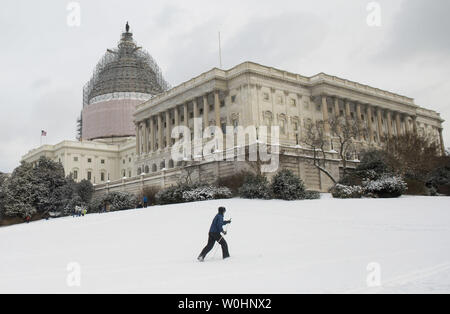 A cross-country skier makes her way past the U.S. Capitol Building after an overnight storm hit Washington, D.C., February 17 2015. A President's Day snow storm dropped 3-6 inches of snow over the metro region. Photo by Kevin Dietsch/UPI Stock Photo