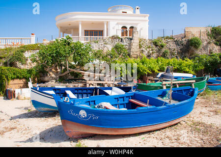 Beautiful old colored fishing wooden boats on the shore, Mediterranean landscape Stock Photo
