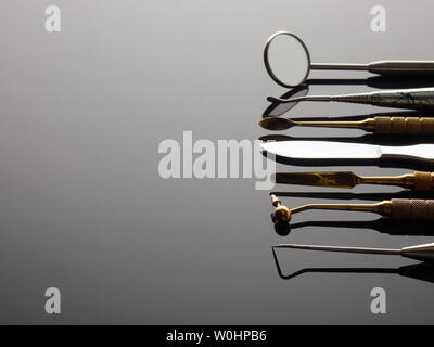 Medical dental tools on gray gradient background Stock Photo
