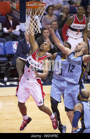 Washington Wizards guard Ramon Sessions shoot for two against Memphis Grizzlies guard Jordan Adams (3) and Nick Calathes during the second quarter at the Verizon Center in Washington, D.C. on March 12, 2015. Photo by Kevin Dietsch/UPI Stock Photo