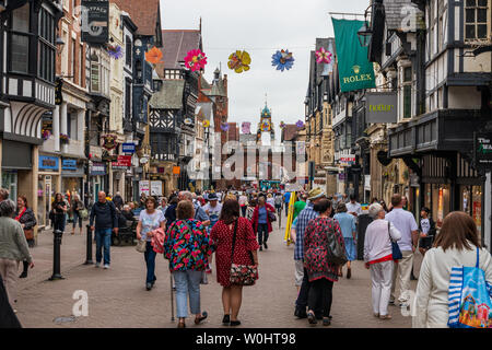 CHESTER, UK - 26TH JUNE 2019: A shot down the busy and famous highstreet in the middle of Chester, UK, June 2019 Stock Photo