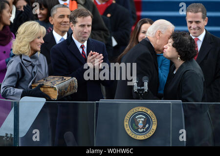 Beau Biden applauds as his father Vice President Joe Biden hugs Supreme Court Justice Sonia Sotomayor after being sworn in during the public inauguration ceremony at the U.S. Capitol Building in Washington, D.C. on January 21, 2013.  Beau Biden died of brain cancer on May 30, 2015, less than two years after being diagnosed.  Jill Biden and President Barack Obama are at left.  Photo by Pat Benic /UPI Stock Photo