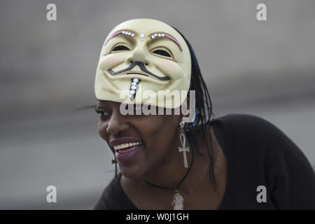 A demonstrator wears a Guy Fawkes mask during the Million Mask March, an anti-establishment protest expected to take part today in over 670 cities worldwide, in Washington, D.C. on November 5, 2015. The march, allegedly organized by Anonymous, the “hacktivist” group linked to cyber-attacks against governments and multi-national corporations, aims at protesting government overreach and corporate greed, among other grievances. Photo by Kevin Dietsch/UPI Stock Photo