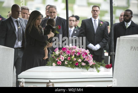 Family and friends mourn at the grave of actress Maureen O'Hara during her funeral, as she is buried to her husband Ret. U.S. Air Force Brig. Gen. Charles Blair, at Arlington National Cemetery in Arlington, Virginia on November 9, 2015. O'Hara, 95, starred in 'Miracle on 34th Street' and other classic hollywood films. Photo by Kevin Dietsch/UPI.