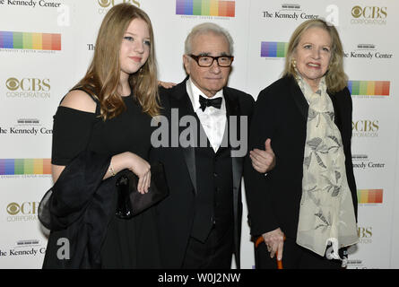 Film Director Martin Scorsese (C), his wife Helen Morris (R) and daughter Francesca pose for photographers on the red carpet as they arrive for an evening of gala entertainment at the Kennedy Center, December 6, 2015, in Washington, DC.  The Honors are bestowed annually on five artists for their lifetime achievement in the arts and culture.    UPI/Mike Theiler Stock Photo