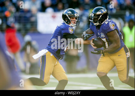 Baltimore Ravens' quarterback Jimmy Clausen passes under heavy pressure  during the fourth quarter against the Kansas City Chiefs' at M&M Bank  Stadium on December 20, 2015 in Baltimore, Maryland. Kansas City won