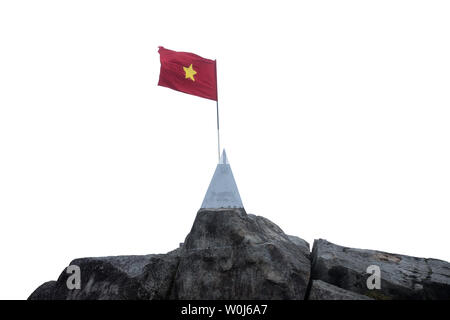 Sapa, Vietnam - Sep 08 2017 : On top Fansipan mountain with flag vietnam waving and monument on stone at 3143 over sea level Stock Photo