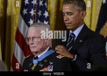 President Barack Obama presents retired Army Lt. Col. (Ret.) Charles Kettles, 86, of Ypsilanti, Mich., with the Medal of Honor during a ceremony in the East Room of the White House in Washington, DC on Monday, July 18, 2016. Kettles is credited with saving the lives of 40 soldiers and four of his own crew members near Duc Pho, Vietnam. Photo by Leigh Vogel/UPI Stock Photo