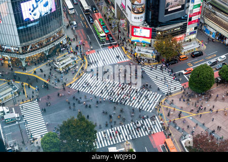 Tokyo, Japan - Nov 08 2017 : Aerial view of Pedestrians walking across with crowded traffic at Shibuya crossing square Stock Photo