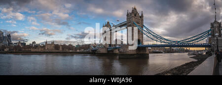 LONDON, ENGLAND, DECEMBER 10th, 2018: Tower Bridge in London, the UK. Sunrise with beautiful clouds. Panoramic view with White Tower and bullet like Stock Photo