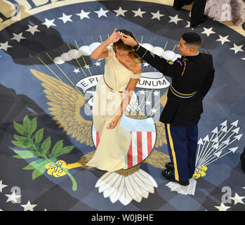 First Lady Melania Trump dances with a Marine at the A Salute to Our Armed Services Ball on January 20, 2017 in Washington, D.C. Trump will attend a series of balls to cap his Inauguration day.   Photo by Kevin Dietsch/UPI Stock Photo