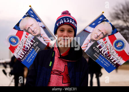Supporters wear Donald Trump apparel during the inauguration ceremony at the Capitol on January 20, 2017 in Washington, D.C.  Trump becomes the 45th President of the United States.  Photo by Michael Wiser/UPI Stock Photo