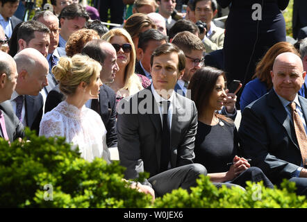 Jared Kushner (C) and wife Ivanka Trump wait for a joint press conference with U.S. President Donald Trump and King Abdullah II of Jordan in the Rose Garden of the White House in Washington, DC on April 5, 2017.   The Jordanian leader is in Washington for a day of meetings.   Photo by Pat Benic/UPI Stock Photo