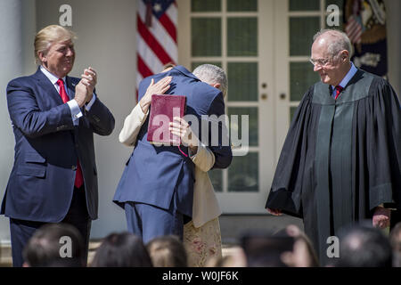 President Donald Trump and Supreme Court Justice Anthony Kennedy look on as Neil Gorsuch is hugged by his wife  Marie Louise after being sworn in to be a Supreme Court Associate Justice in the Rose Garden at the White House on April 10, 2017 in Washington, DC. Gorsuch was sworn in earlier in the morning at the U.S. Supreme Court by Chief Justice John Roberts. Gorsuch is the 113th justice in the history of the Supreme Court.      Photo by Pete Marovich/UPI Stock Photo