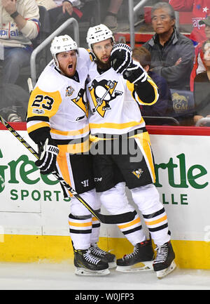 Pittsburgh Penguins center Nick Bonino (13) celebrates with Scott Wilson (23) after scoring against the Washington Capitals in the third period of the Eastern Conference Semifinals at the Verizon Center in Washington, D.C. on April 27, 2017. Photo by Kevin Dietsch/UPI Stock Photo